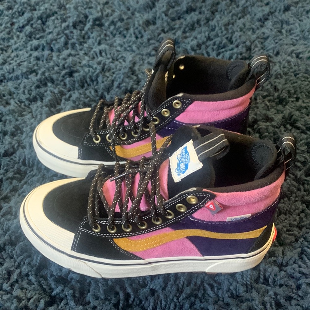 Brand new vans. Pink, purple, yellow and mainly black size 8 shoes with tags